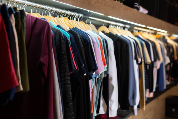 istock Stand with various clothes in clothing boutique 1191650146