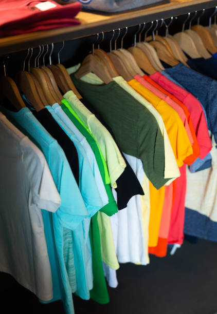 istock Stand with various clothes in clothing boutique 1191650156