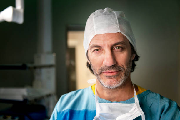 Surgeon portrait, taken in the operating room, illuminated by surgical lights.