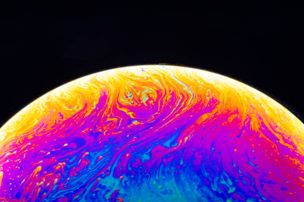 istock Macro shot of a soap bubble hemisphere. Abstract colorful liquid background. 1191652275