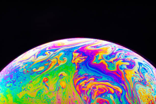 istock Macro shot of a soap bubble hemisphere. Abstract colorful liquid background. 1191652342
