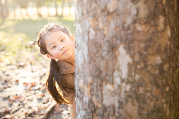 istock Cute girl with big tree 1191652389