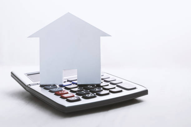 house symbol with calculator on white stock photo