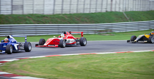 istock Drivers driving racing car 1191655597