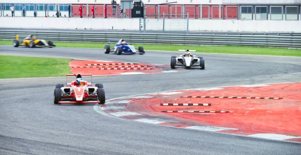 istock Drivers driving racing car 1191655641