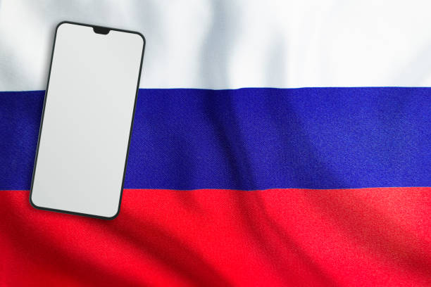 istock Modern Mobile Phone on Full Frame Russian Flag 1191658912