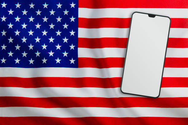 istock Modern Mobile Phone on Full Frame USA Flag 1191659656