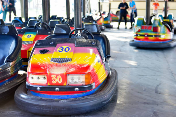Mother with son in bumper car laughing