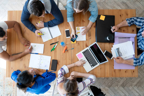 istock Young business team working together at office 1191660066