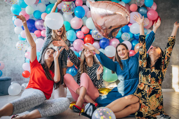 istock Girlfriends having fun with balloons together 1191660211
