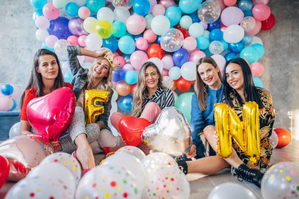 istock Girlfriends having fun with balloons 1191660354