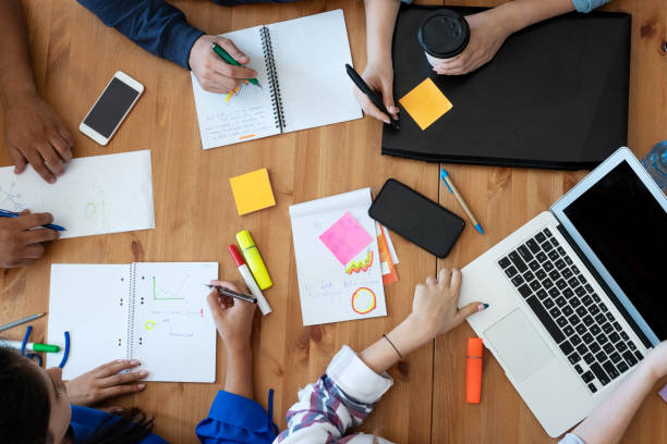 istock Young business team working together at office 1191660382