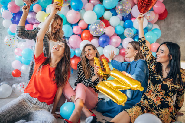 istock Group of women having fun with balloons 1191660434