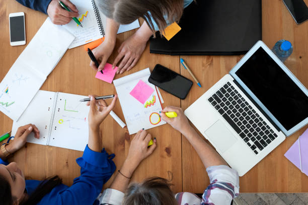 istock Young business team working together at office 1191660457
