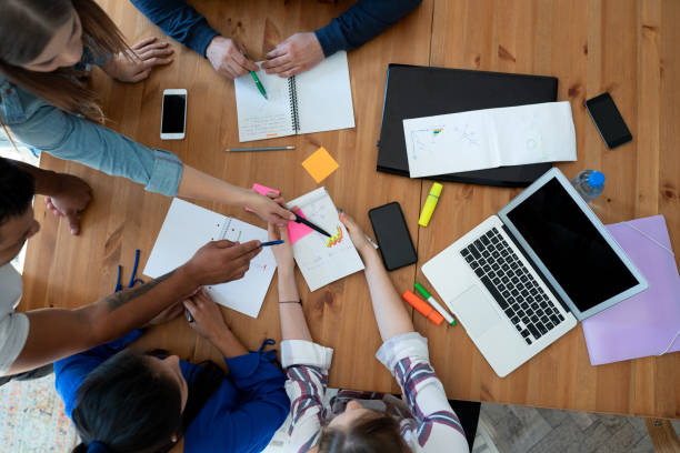 istock Young business team working together at office 1191661108