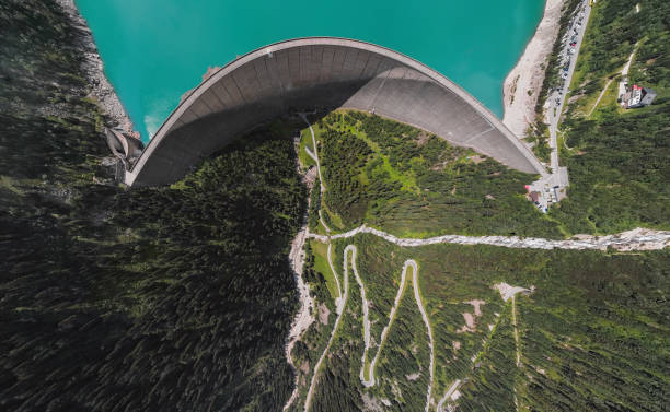 Wide angle overhead aerial view of Schlegeis Stausee reservoir dam and panoramic Alpine Road in the Zillertal Alps, Tirol, Austria. Aerial panorama of Schlegeis Stausee dam, Austria. zillertaler alps stock pictures, royalty-free photos & images