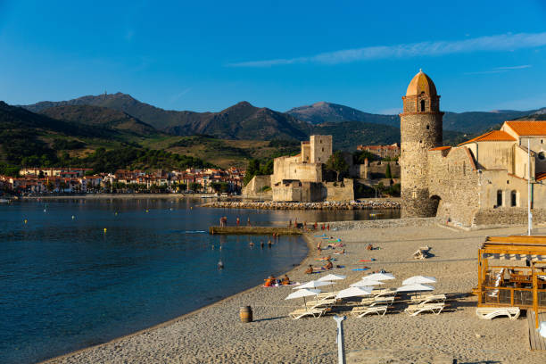 French coastal village Collioure View of picturesque French coastal village Collioure in Mediterranean bay with ancient Church of Our Lady of Angels collioure stock pictures, royalty-free photos & images
