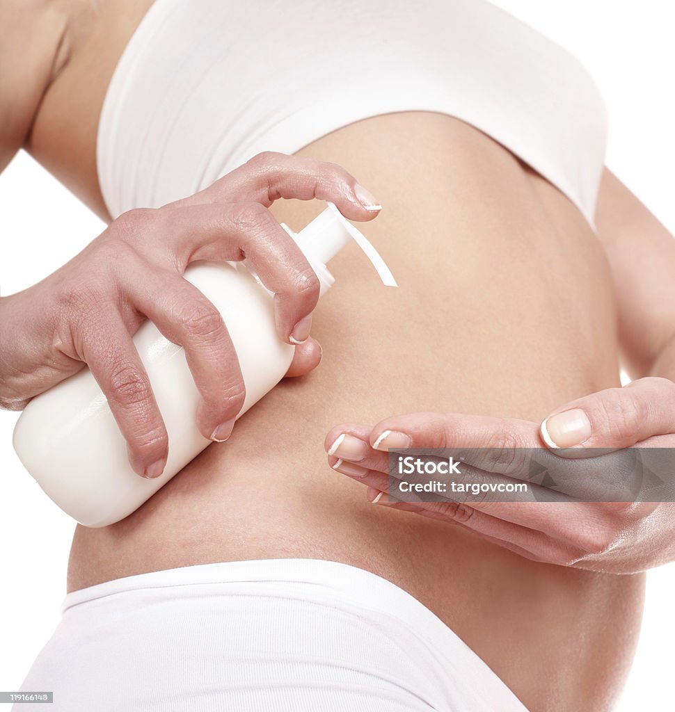 Parte del cuerpo con blanco crema. - Foto de stock de Abdomen humano libre de derechos