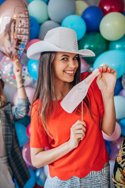 istock Lady standing in front of balloons 1191661921