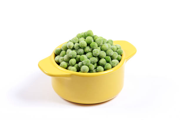 istock Frozen vegetables Green Peas on white background awaiting preparation for cooking 1191665545