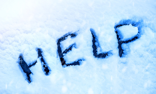 Word Help, written on a snow. Snow blockage concept.