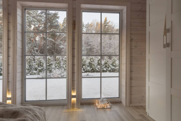 istock Bright photo studio interior with big window, high ceiling, white wooden floor 1191668290