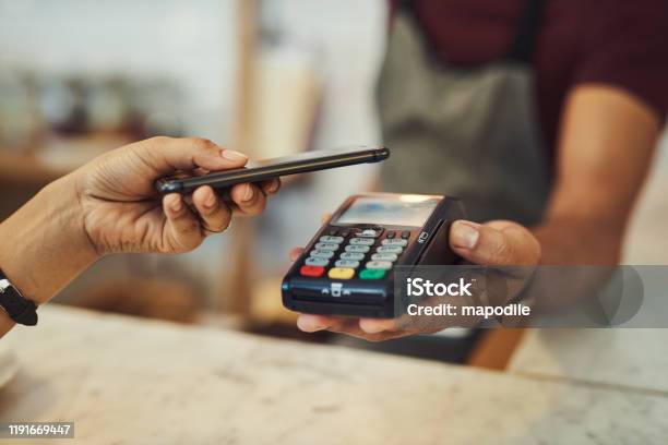 There Are Many Smart Ways To Manage Your Money Stock Photo - Download Image Now - Paying, Mobile Payment, Tapping
