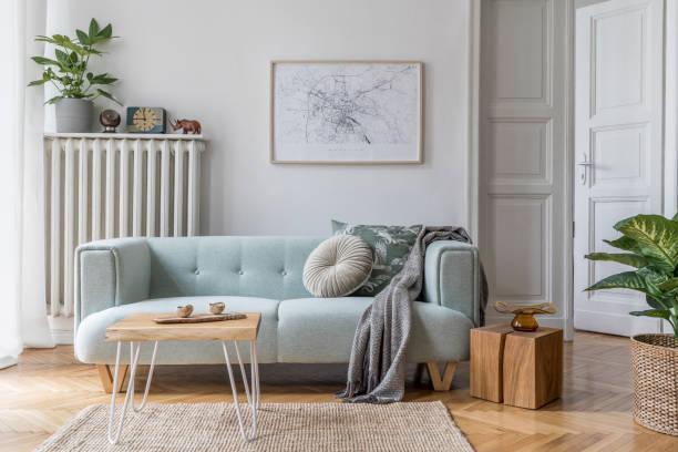 modern scandinavian living room interior with stylish mint sofa, furnitures, mock up poster map, plants, and elegant personal accessories. home decor. interior design. template. ready to use. - hotel room hotel bedroom picture frame imagens e fotografias de stock