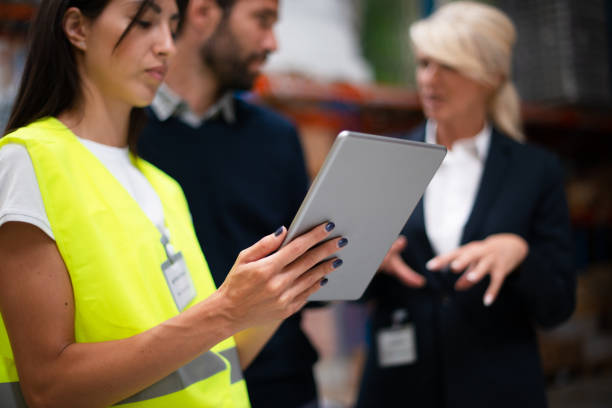 istock Managers checking the list of products 1191673827