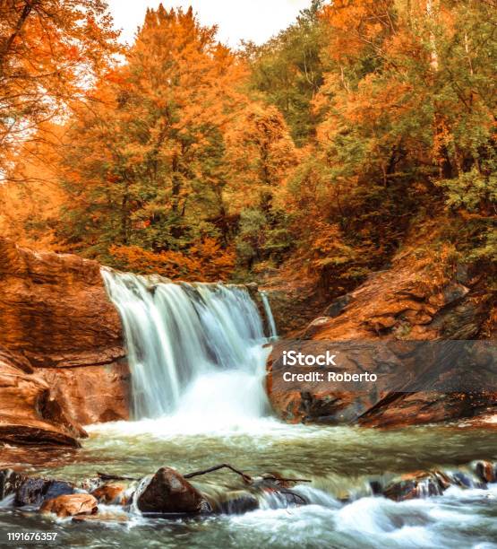 A Beautiful Waterfall In Autumn Colors Stock Photo - Download Image Now - Autumn, Beauty, Buzău