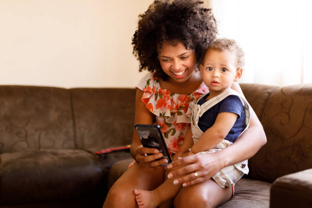 istock Mom and baby using cell phone 1191676518