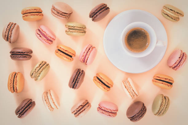 istock Indulge yourself- Macaroons and a espresso on a pastel background 1191677561