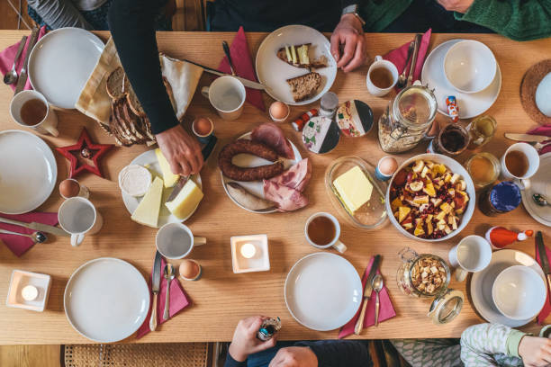 overhead view on family around wooden brunch table