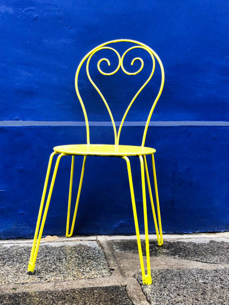 istock Yellow Chair With Blue Background 1191680020