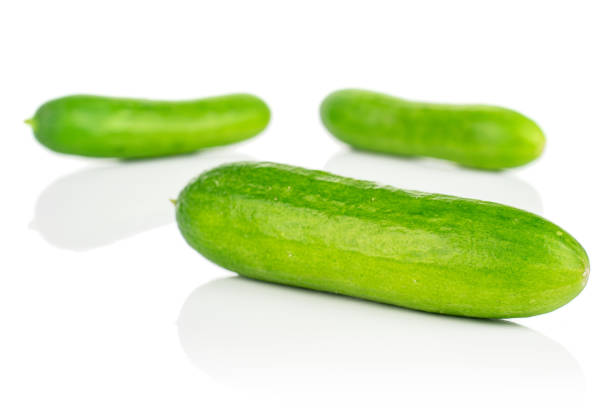 istock Fresh green baby cucumber isolated on white 1191680128