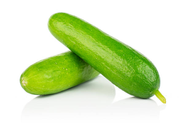 istock Fresh green baby cucumber isolated on white 1191680164