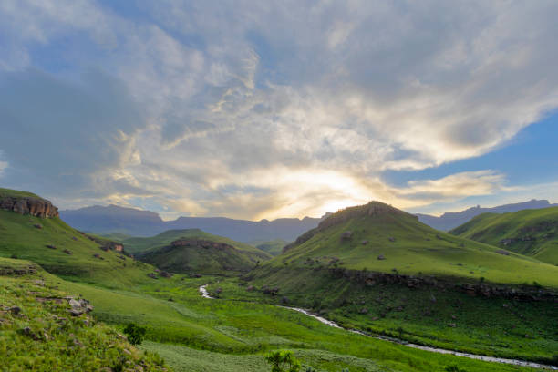 istock Sunset over green valley in the mountains 1191680216