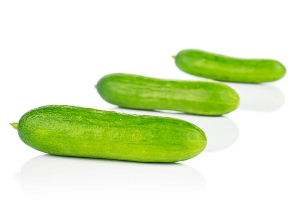istock Fresh green baby cucumber isolated on white 1191680284