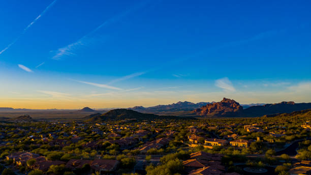 Arizona sunset an aerial view of a sunset on a golf community in Arizona. mesa arizona stock pictures, royalty-free photos & images