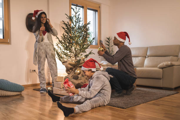 istock Single father with kids preparing Christmas decorating together 1191682129