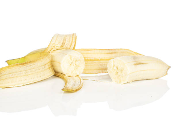 Sweet yellow banana isolated on white Group of two halves of open sweet yellow banana isolated on white background plantain banana banana tree tropical climate stock pictures, royalty-free photos & images