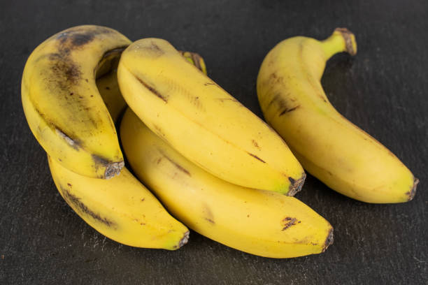istock Sweet yellow banana on grey stone 1191682614