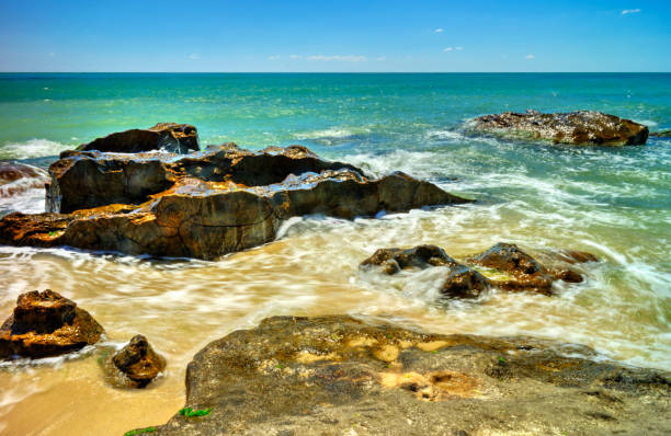 istock Beautiful landscape with rocks and sea waves on a beach 1191686884