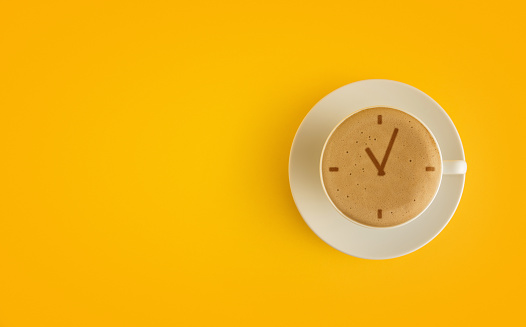 Clock symbol with frothy coffee. 'Coffee Time' Concept.