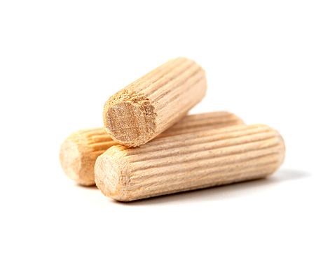 Wooden dowels close-up isolated on a white background, front view