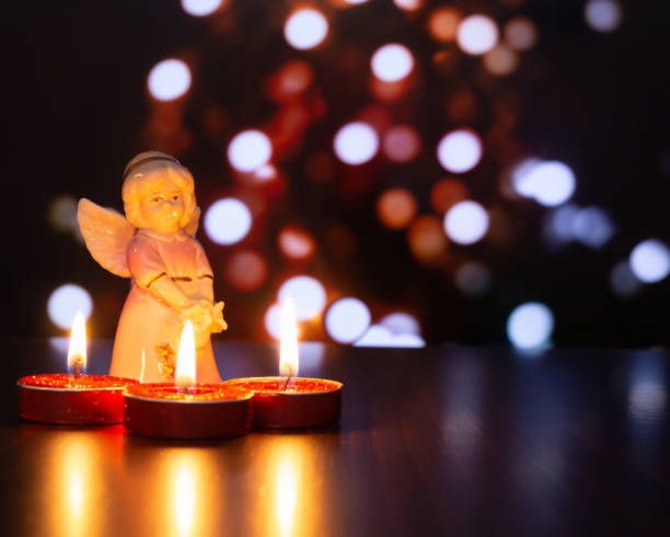 istock Christmas angel with candles 1191691394