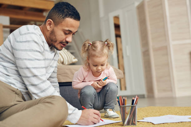 istock Young Dad Drawing with Daughter 1191693102