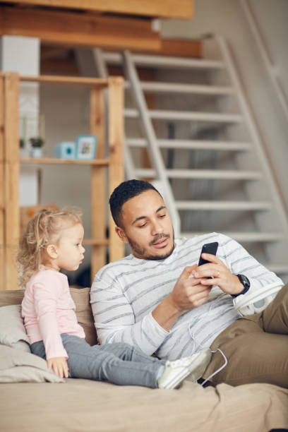 istock Father Showing Smartphone Videos to Kid 1191693285