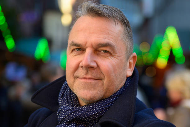 istock Serious stylish middle-aged man in winter outfit 1191694191
