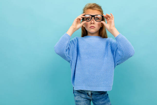istock child with glasses and low vision on a blue background 1191699695